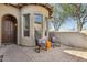Inviting front patio area with two chairs and an orange table, perfect for enjoying the outdoor ambiance at 7221 E Eclipse Dr, Scottsdale, AZ 85266