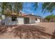 Backyard view of home featuring covered patio, stucco siding, and tile roof at 743 N Bermuda --, Mesa, AZ 85205