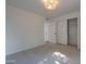 Brightly lit bedroom with neutral carpet and a closet for ample storage at 743 N Bermuda --, Mesa, AZ 85205