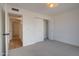 Bedroom showcasing carpeted floors, closet and hallway at 743 N Bermuda --, Mesa, AZ 85205