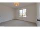 Bedroom showcasing carpeted floors and a bright light fixture at 743 N Bermuda --, Mesa, AZ 85205