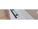Close-up of a modern black cabinet handle, showcasing minimalist design at 743 N Bermuda --, Mesa, AZ 85205