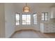 Bright dining area with black framed windows and modern light fixture at 743 N Bermuda --, Mesa, AZ 85205