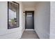 This image showcases the front entrance with its black front door and surrounding textured walls at 743 N Bermuda --, Mesa, AZ 85205