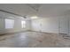 Spacious and clean garage with a window for natural light and an entrance door at 743 N Bermuda --, Mesa, AZ 85205