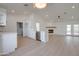 Open floor plan featuring bright white kitchen with stainless steel appliances and fireplace at 743 N Bermuda --, Mesa, AZ 85205