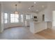 Bright open floor plan with white kitchen featuring a kitchen island and bay windows at 743 N Bermuda --, Mesa, AZ 85205