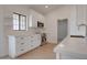 Bright kitchen with stainless steel appliances, quartz countertops, and white cabinets at 743 N Bermuda --, Mesa, AZ 85205