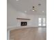 Cozy living room with white brick fireplace and wood mantle and bright white french doors at 743 N Bermuda --, Mesa, AZ 85205