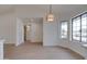 Spacious living room with large windows, light wood floors, and modern lighting at 743 N Bermuda --, Mesa, AZ 85205