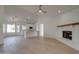 Open floor plan with hardwood floors, white brick fireplace and seamlessly connected kitchen at 743 N Bermuda --, Mesa, AZ 85205