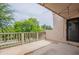 Inviting covered balcony featuring views of green trees and foliage, with outdoor lighting at 7800 E Lincoln Dr # 2029, Scottsdale, AZ 85250