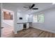 Bright bedroom with a bar featuring white cabinets, a wine cooler, and a ceiling fan at 7800 E Lincoln Dr # 2029, Scottsdale, AZ 85250