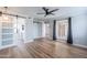 Primary bedroom with wood floors, recessed lighting, barn door to the bathroom, and window view, creating a serene retreat at 7800 E Lincoln Dr # 2029, Scottsdale, AZ 85250