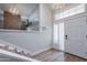 Bright entryway with hardwood floors, a stylish chandelier, and a staircase leading to the upper level at 7800 E Lincoln Dr # 2029, Scottsdale, AZ 85250
