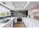 Stylish kitchen boasts white cabinetry, stainless steel appliances, light countertops, and a modern backsplash under recessed lighting at 7800 E Lincoln Dr # 2029, Scottsdale, AZ 85250