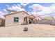 The backyard offers a fire pit and a covered patio with a grill at 8924 N 102Nd Ln, Peoria, AZ 85345