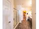 Hallway view of the bathroom, including the shower and double sinks at 8924 N 102Nd Ln, Peoria, AZ 85345
