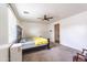Bright bedroom with a ceiling fan and carpet flooring at 8924 N 102Nd Ln, Peoria, AZ 85345