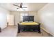 Bedroom featuring a large bed and neutral walls at 8924 N 102Nd Ln, Peoria, AZ 85345