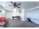 Large game room with pool table, leather sofa, popcorn machine, and home theater setup at 8924 N 102Nd Ln, Peoria, AZ 85345