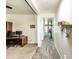 Bright hallway with decorative wall accents and stylish wood-look tile flooring leading to living spaces at 8924 N 102Nd Ln, Peoria, AZ 85345