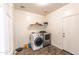 Convenient laundry room with modern washer and dryer units at 8924 N 102Nd Ln, Peoria, AZ 85345
