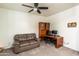 Comfortable office space with a sofa and desk at 8924 N 102Nd Ln, Peoria, AZ 85345