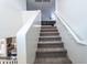 Carpeted staircase leads to the upper level of the home at 8924 N 102Nd Ln, Peoria, AZ 85345