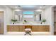 Bright bathroom featuring double sinks, vanity, and ample storage space at 9669 E Chino Dr, Scottsdale, AZ 85255