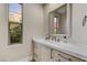 Bathroom with a modern vanity, decorative window, and plenty of natural light at 9669 E Chino Dr, Scottsdale, AZ 85255