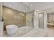 A spacious bathroom has a soaking tub and large glass enclosed shower with dual shower heads at 9669 E Chino Dr, Scottsdale, AZ 85255