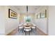 Formal dining room with wainscoting, modern chandelier, and a large table for entertaining at 9669 E Chino Dr, Scottsdale, AZ 85255