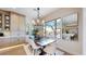 Dining room with large windows offering natural light, custom cabinets, and modern decor at 9669 E Chino Dr, Scottsdale, AZ 85255