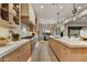 Gorgeous kitchen features a large island, granite countertops, modern appliances, and lots of natural light at 9669 E Chino Dr, Scottsdale, AZ 85255