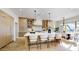 Spacious kitchen with a large island, custom cabinetry, and an adjacent dining area at 9669 E Chino Dr, Scottsdale, AZ 85255
