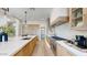 Bright kitchen featuring wooden cabinets, stone counter tops, and stainless steel appliances at 9669 E Chino Dr, Scottsdale, AZ 85255