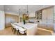 Modern kitchen with a large center island, pendant lighting, and high-end stainless steel appliances at 9669 E Chino Dr, Scottsdale, AZ 85255