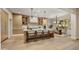 Spacious kitchen with sleek island, modern lighting, stainless steel appliances, and adjacent dining area perfect for entertaining at 9669 E Chino Dr, Scottsdale, AZ 85255