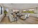 Bright living room with modern seating, two TVs, and scenic outdoor views at 9669 E Chino Dr, Scottsdale, AZ 85255