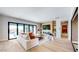 Elegant living room featuring a modern fireplace, a comfortable sofa, and sliding glass doors at 9669 E Chino Dr, Scottsdale, AZ 85255
