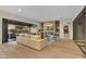A spacious living room featuring a fireplace, entertainment center, and an open layout with a patio view at 9669 E Chino Dr, Scottsdale, AZ 85255