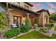 Inviting outdoor space featuring a covered porch, lush landscaping, and charming seating arrangement at 9669 E Chino Dr, Scottsdale, AZ 85255