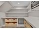 Walk-in pantry with custom shelves and drawers to keep your kitchen organized and clutter-free at 9669 E Chino Dr, Scottsdale, AZ 85255