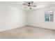 Neutral carpeted bedroom with a window at 9837 E Satellite Dr, Mesa, AZ 85212