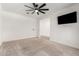 Bedroom with a ceiling fan and a mounted television at 9837 E Satellite Dr, Mesa, AZ 85212