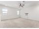 Bright and airy carpeted bedroom with a ceiling fan and plenty of natural light at 9837 E Satellite Dr, Mesa, AZ 85212