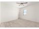 Bright bedroom with a window view and neutral carpet at 9837 E Satellite Dr, Mesa, AZ 85212
