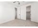Comfortable bedroom featuring neutral carpet and access to a walk-in closet at 9837 E Satellite Dr, Mesa, AZ 85212