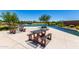 Inviting community space with picnic tables, lush landscaping, and water features, perfect for outdoor enjoyment and relaxation at 9837 E Satellite Dr, Mesa, AZ 85212